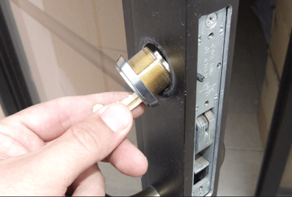 Technician helping unlock a storefront door